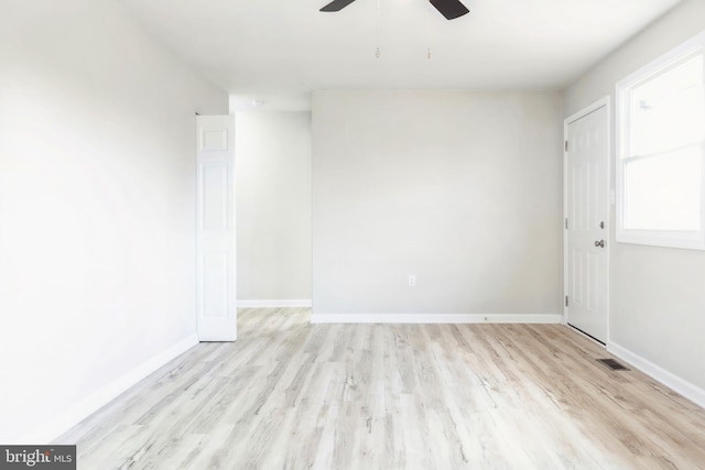 empty room featuring ceiling fan and light hardwood / wood-style floors