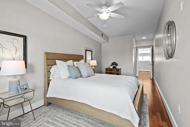 bedroom with ceiling fan and hardwood / wood-style floors