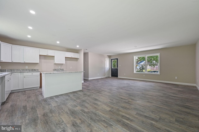 613 W 8th St, Laurel, DE 19956 - kitchen with a kitchen island, recessed lighting, dark wood-style flooring, open floor plan, and white cabinetry
