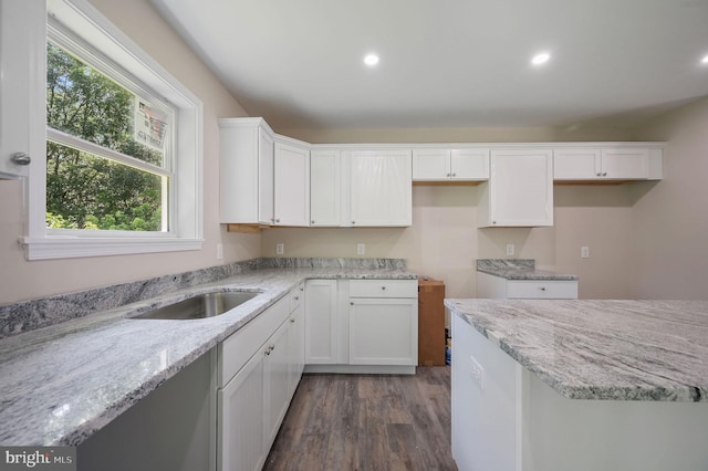 613 W 8th St, Laurel, DE 19956 - kitchen with plenty of natural light, light stone counters, dark wood-style flooring, and recessed lighting