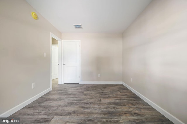 613 W 8th St, Laurel, DE 19956 - empty room with baseboards and dark wood finished floors