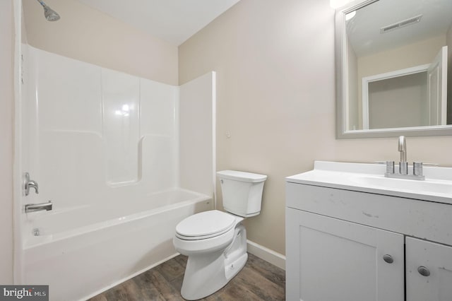 613 W 8th St, Laurel, DE 19956 - full bath with wood finished floors, vanity, and shower / bath combination