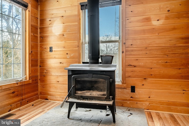 interior details with a wood stove and wooden walls