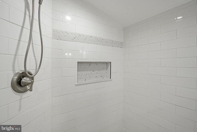 bathroom with tiled shower