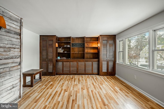 unfurnished living room with light wood-type flooring