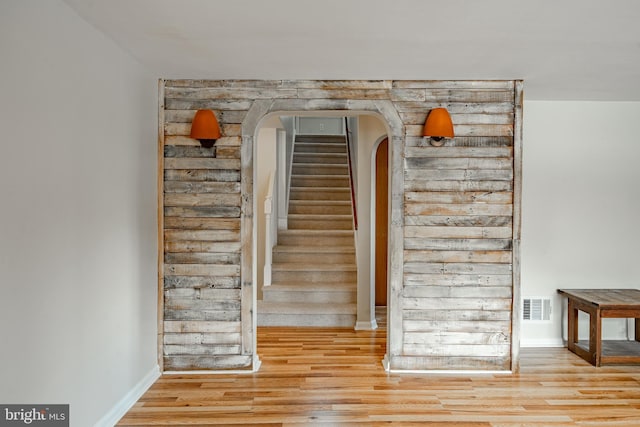 stairway featuring wood-type flooring