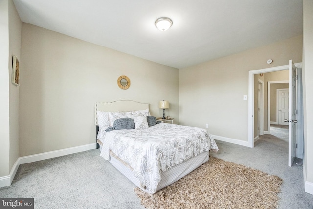 bedroom with light colored carpet