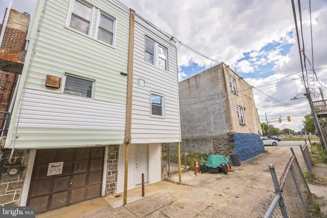 view of side of property with a garage