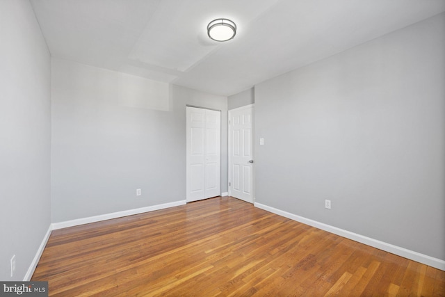 unfurnished room featuring hardwood / wood-style flooring