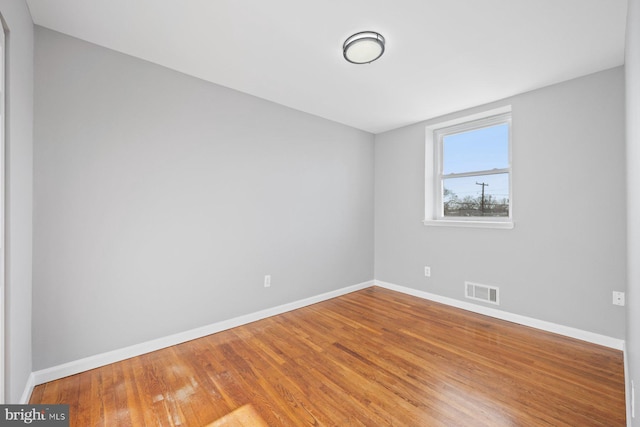 empty room featuring hardwood / wood-style flooring