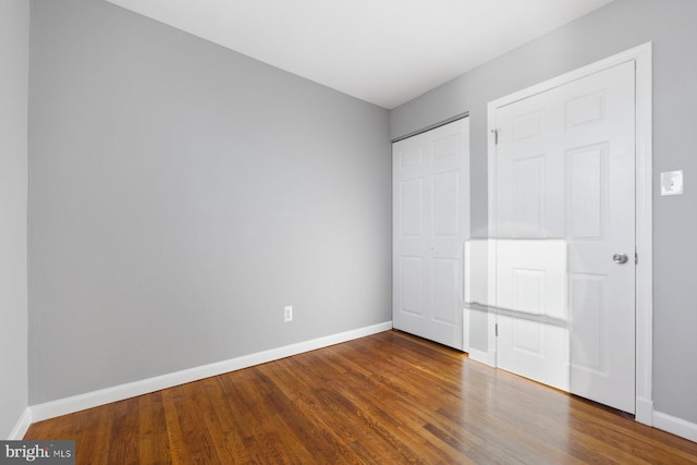 unfurnished bedroom featuring hardwood / wood-style floors