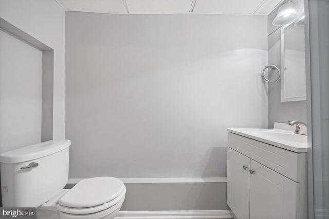 bathroom featuring toilet and vanity