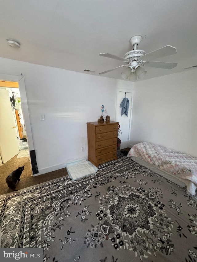 carpeted bedroom with ceiling fan