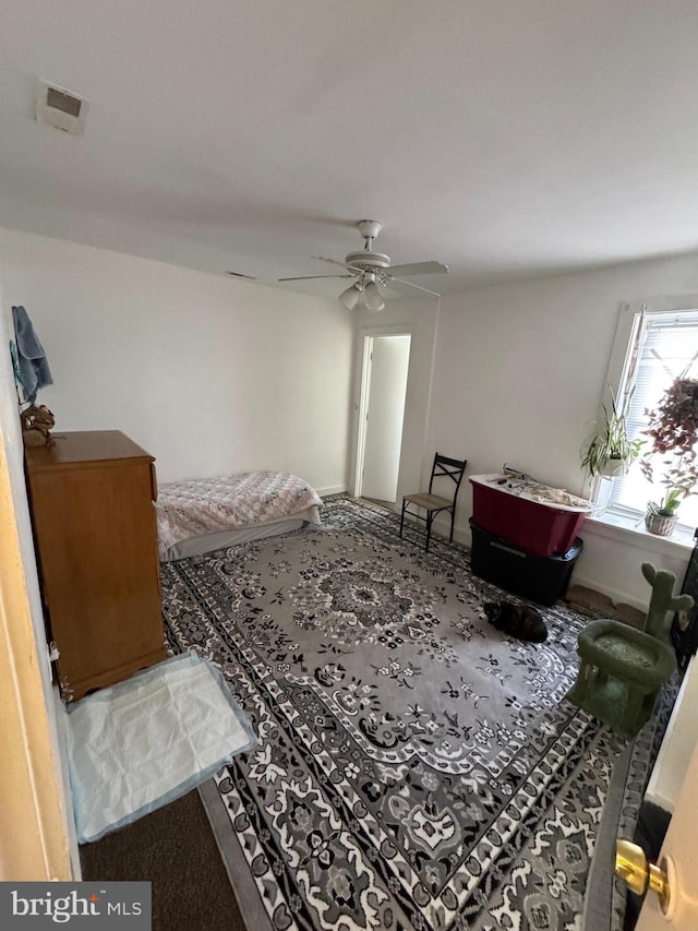 bedroom featuring ceiling fan and carpet flooring