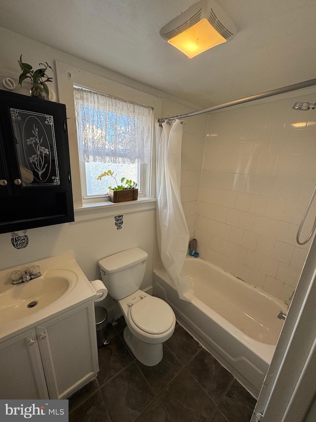 full bathroom featuring toilet, tile patterned floors, vanity, and shower / bath combo with shower curtain