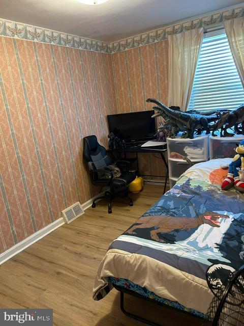 bedroom featuring hardwood / wood-style floors