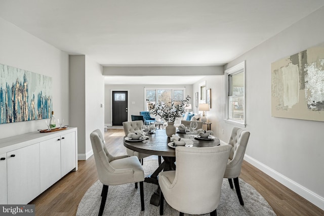 dining space featuring dark hardwood / wood-style flooring