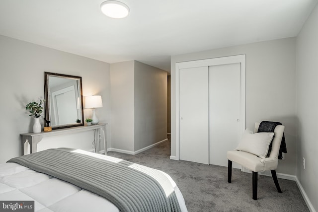 carpeted bedroom featuring a closet