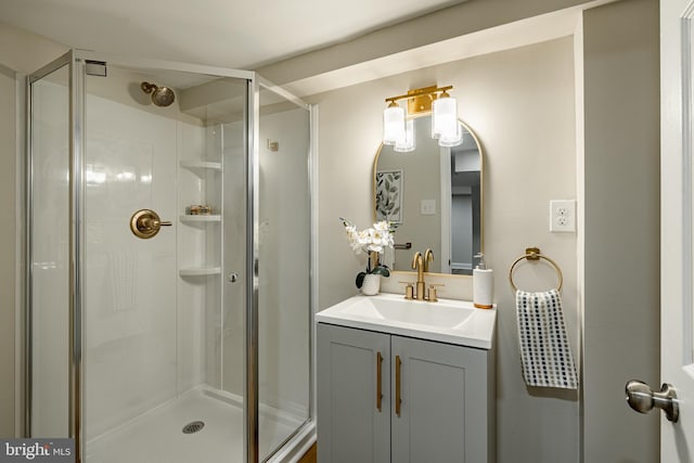 bathroom featuring vanity and a shower with door