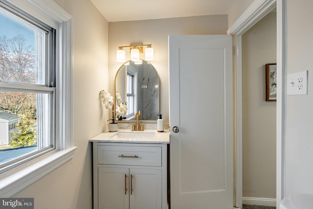 bathroom with vanity and a healthy amount of sunlight