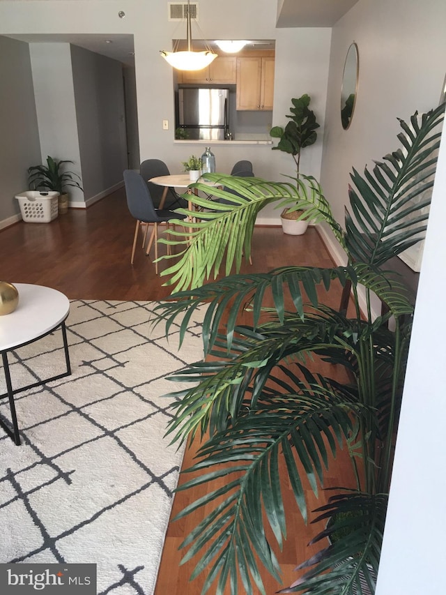 living room featuring dark hardwood / wood-style flooring