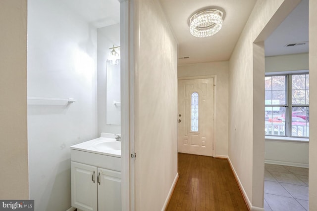 bathroom with hardwood / wood-style floors and vanity