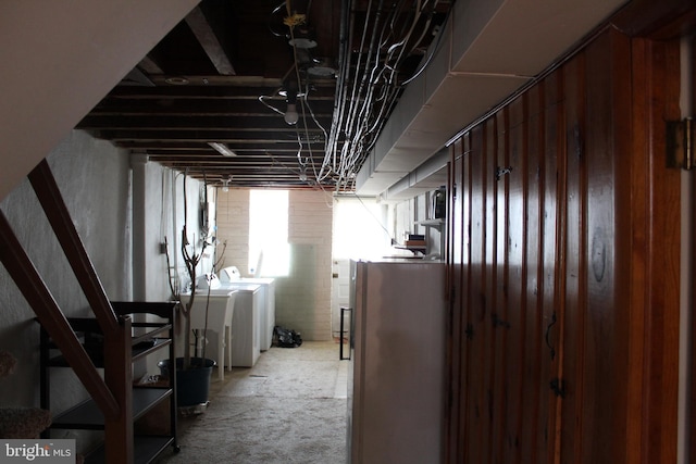 basement featuring carpet and washer and dryer