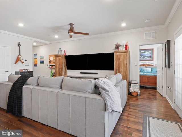 living room with crown molding, ceiling fan, and dark hardwood / wood-style floors