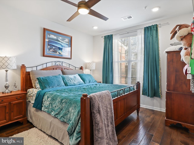 bedroom with ceiling fan and dark wood-type flooring