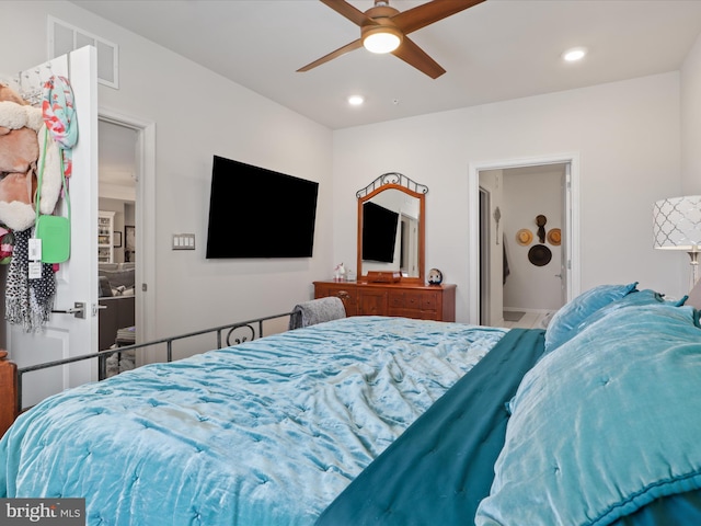 bedroom featuring connected bathroom and ceiling fan