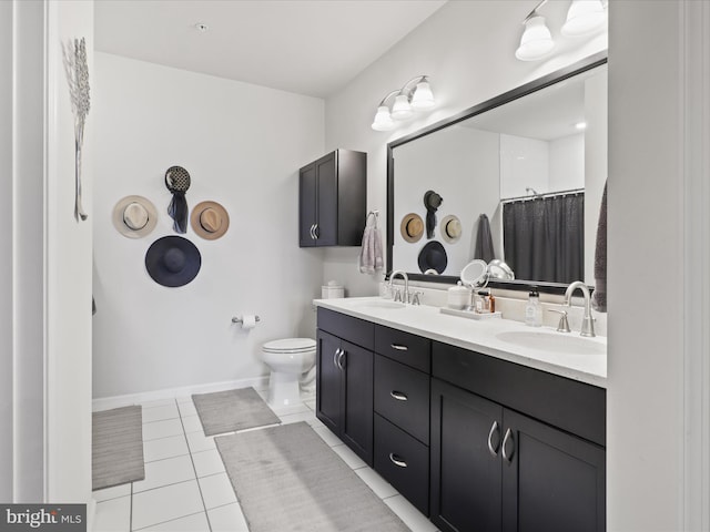 bathroom featuring tile patterned floors, vanity, toilet, and walk in shower