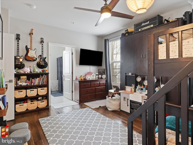 bedroom with ceiling fan and dark hardwood / wood-style flooring