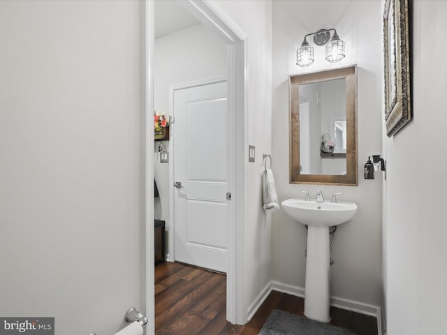 bathroom with hardwood / wood-style floors and sink