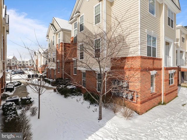 view of snow covered property