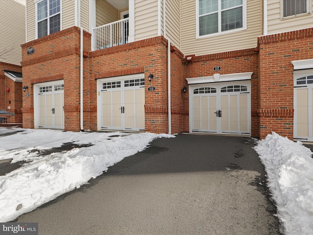 view of snow covered garage