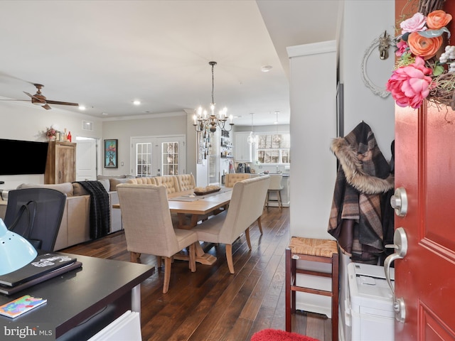 dining area featuring french doors, crown molding, dark hardwood / wood-style flooring, and ceiling fan with notable chandelier