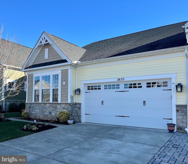 craftsman inspired home featuring a garage