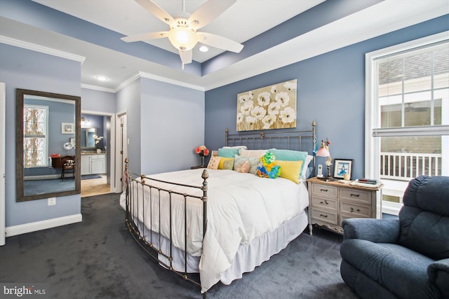 bedroom with ceiling fan, dark carpet, and multiple windows