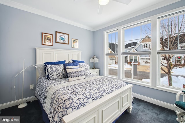 carpeted bedroom featuring ceiling fan, multiple windows, and ornamental molding