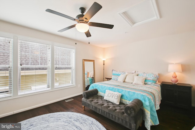 bedroom with ceiling fan and dark wood-type flooring