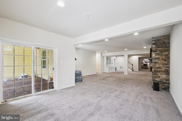 unfurnished living room with carpet floors