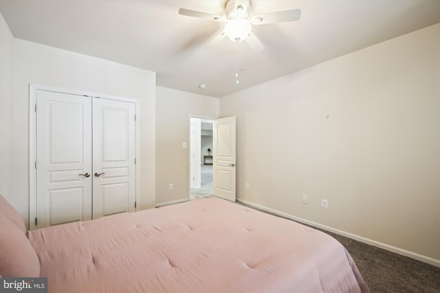 carpeted bedroom featuring ceiling fan and a closet