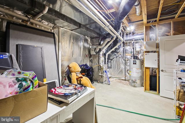 basement featuring water heater and heating unit