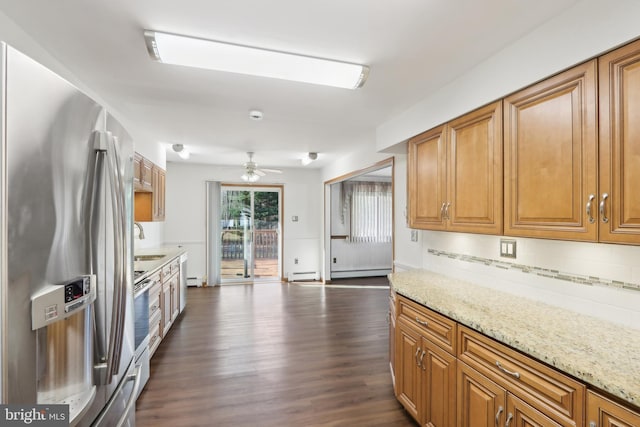 kitchen featuring sink, ceiling fan, light stone counters, and stainless steel appliances