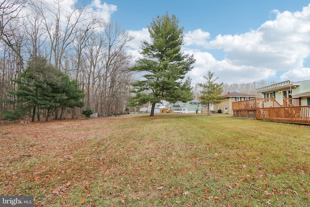 view of yard featuring a wooden deck