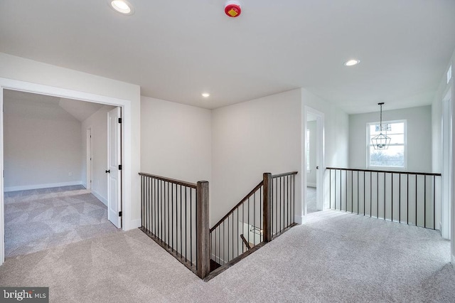 corridor with light colored carpet