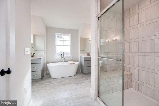 bathroom featuring vanity and plus walk in shower