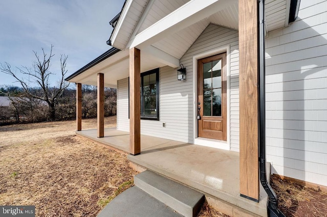 doorway to property featuring covered porch