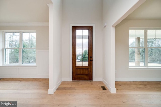 entrance foyer with light wood-type flooring and plenty of natural light