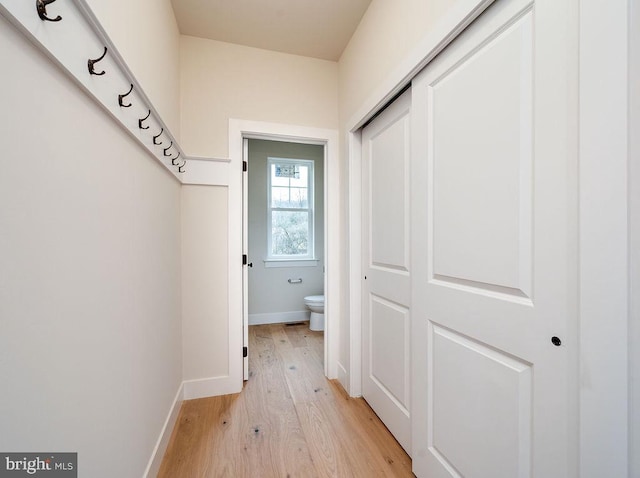 hallway with light wood-type flooring